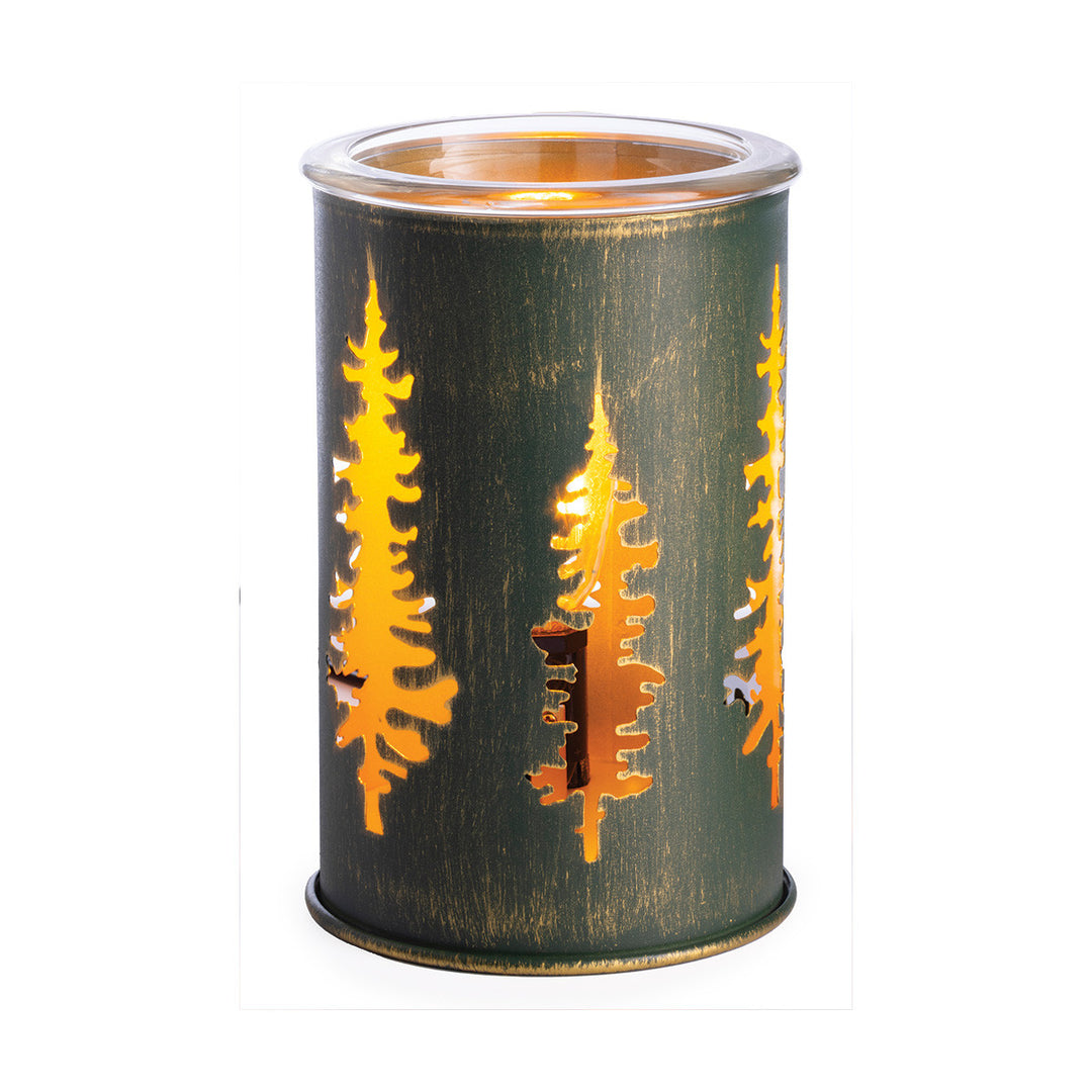 Cylindrical candle holder with tree cutouts on a white background