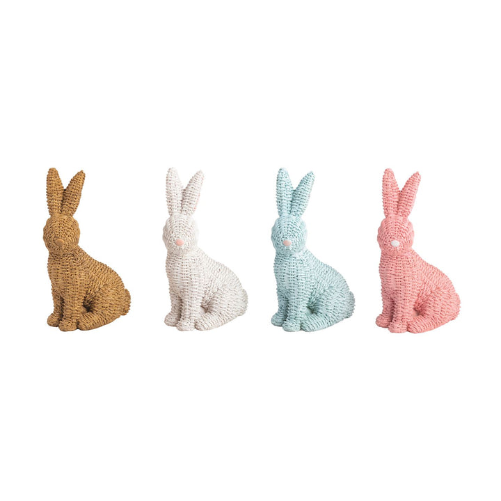 Four colorful rabbit figurines in different colors on a white background