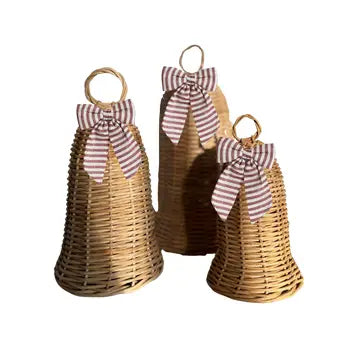 Three woven rattan decorative bells styled with red and cream striped ribbon bows for vintage-inspired Christmas decor.