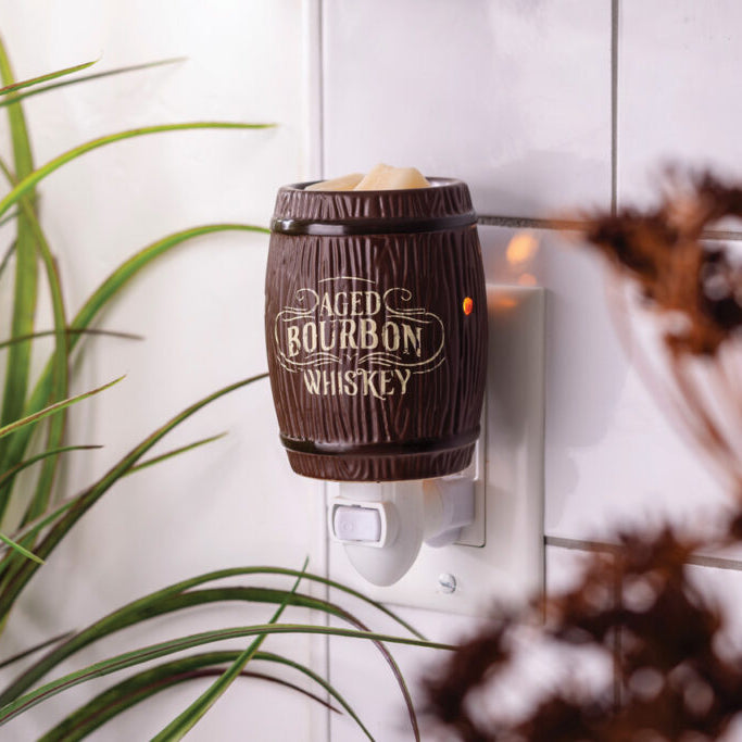 Decorative night light shaped like a barrel with 'Bourbon Whiskey' text, mounted on a wall.
