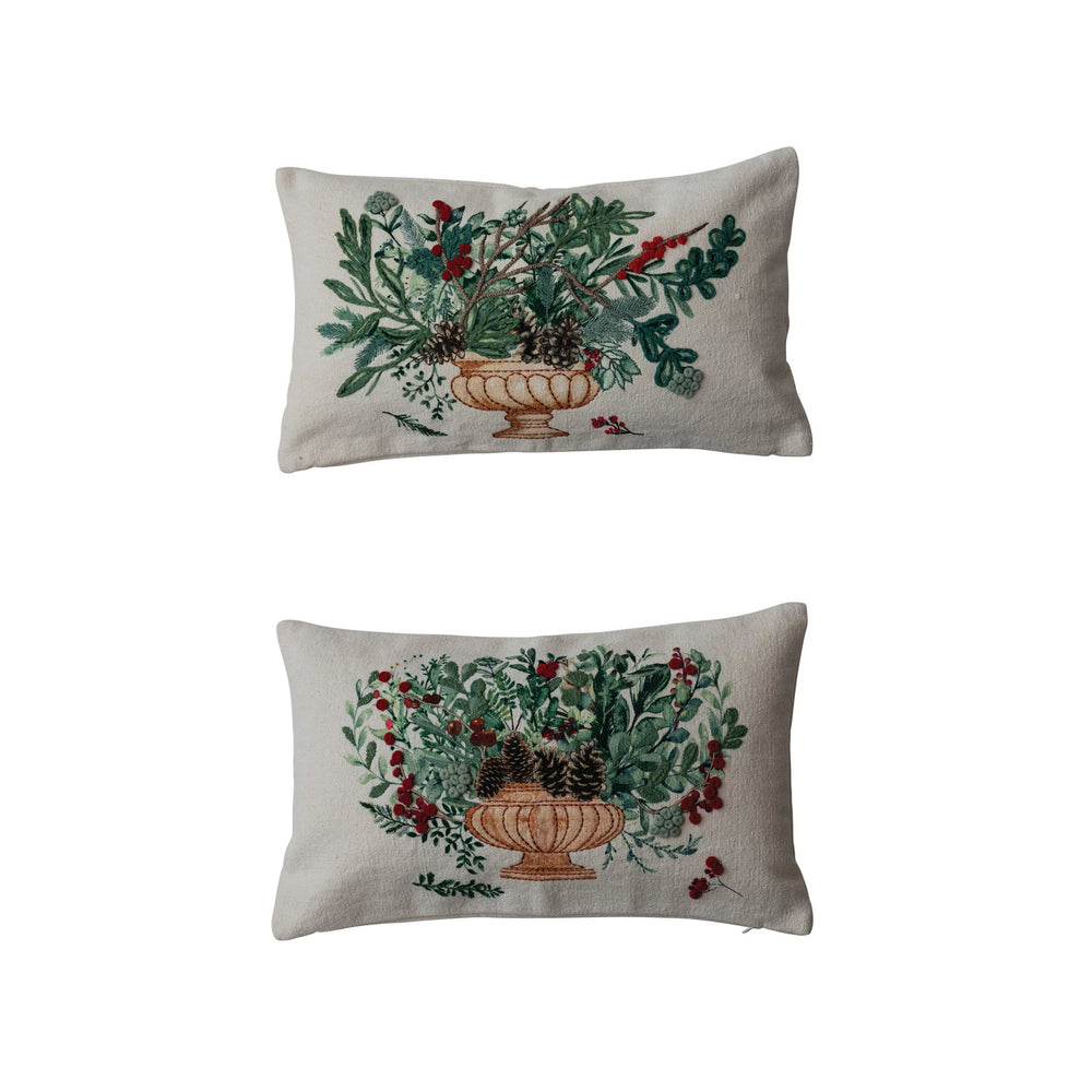 Two decorative pillows with floral patterns on a white background
