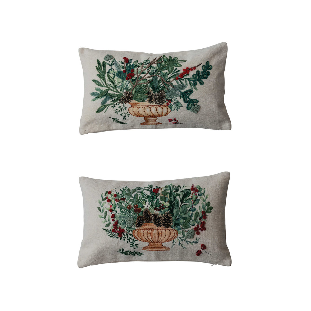 Two decorative pillows with floral patterns on a white background