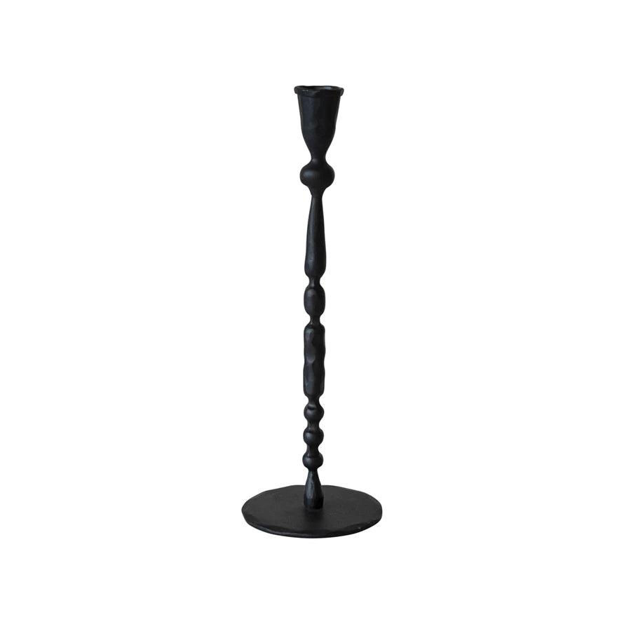 Black candlestick holder on a white background