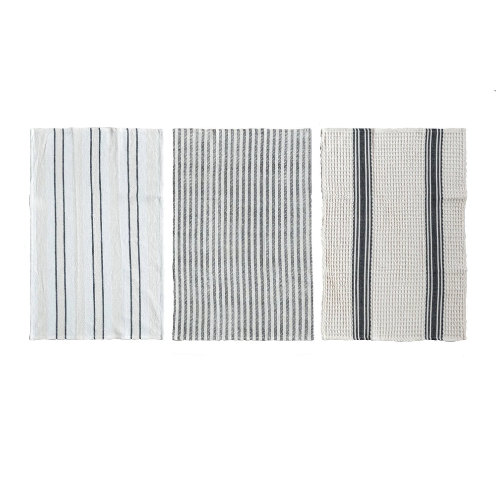 Three different patterns of a towel on a white background
