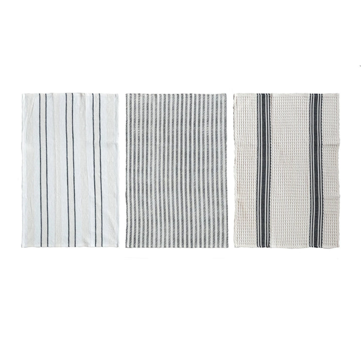 Three different patterns of a towel on a white background