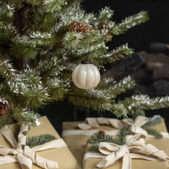 3-inch ivory ribbed glass Christmas ornament with dark hanging cap