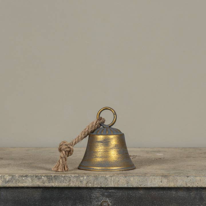 Aged gold bell with dark distressed accents, round top ring and natural-look rope