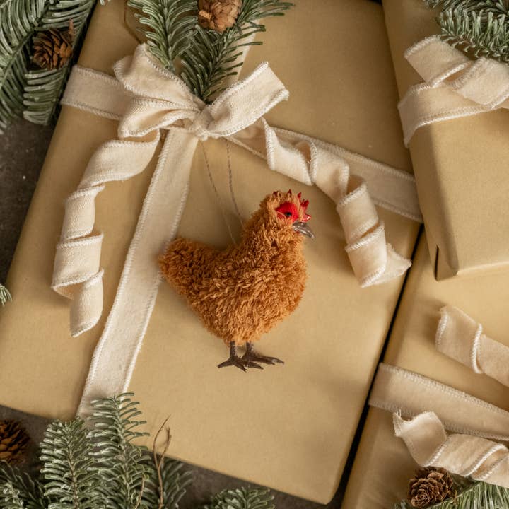 Brown hen hanging ornament with shaggy texture, red comb and dark beak and feet