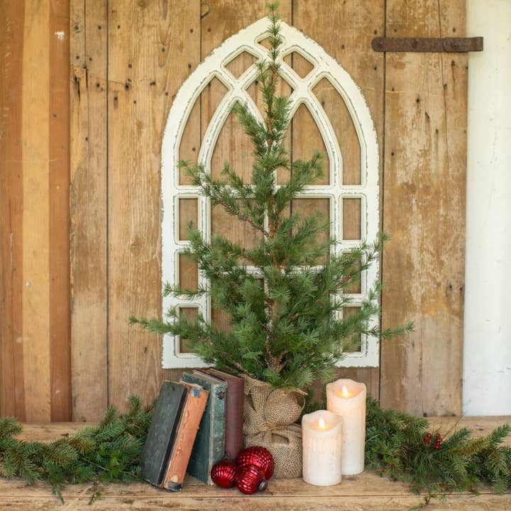 3-foot artificial pine tree with airy green branches and a burlap-wrapped base