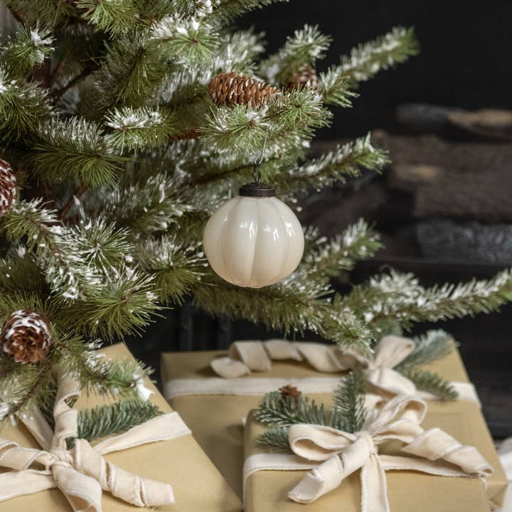 4-inch ivory ribbed glass Christmas ornament with dark hanging cap