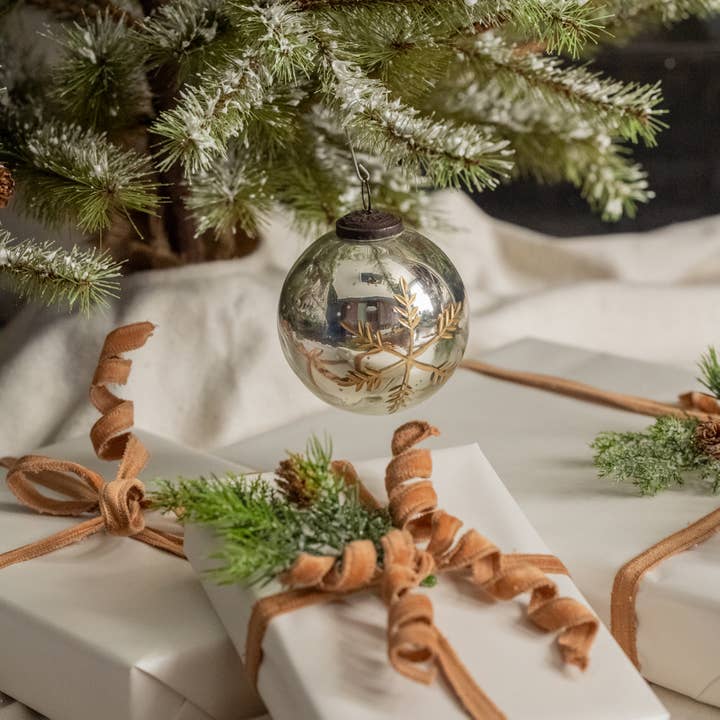 4-inch silver kugel ornament with gold-colored snowflake design